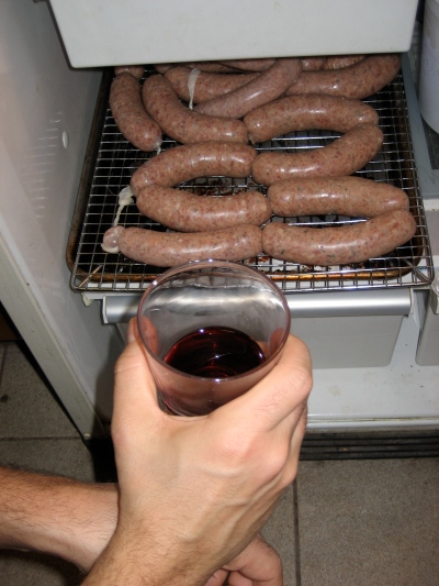 Staged Shot - Theo Peck drinks red wine while making duck sausage - how edgy